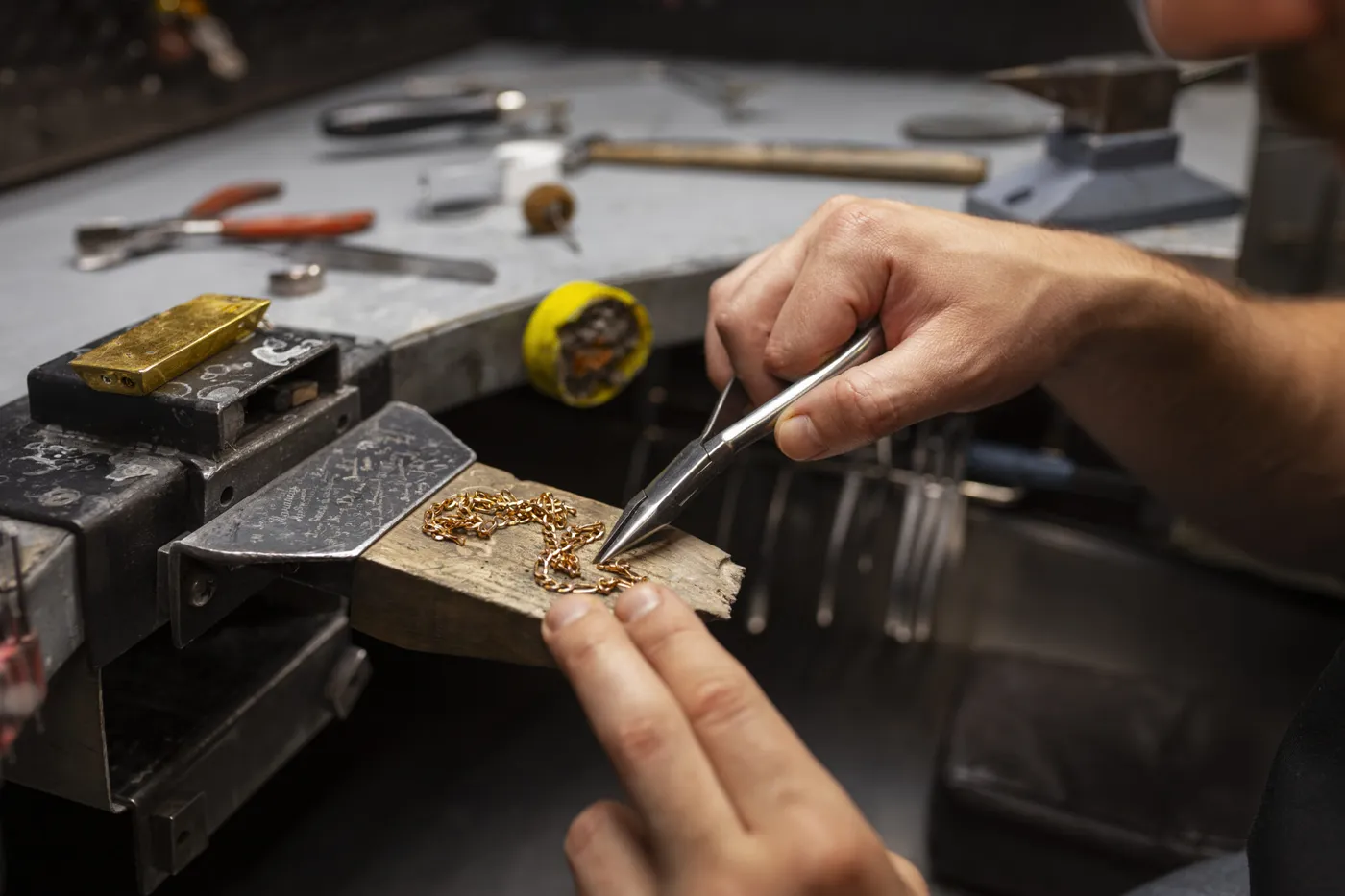 Jeweller working carefully at a bench